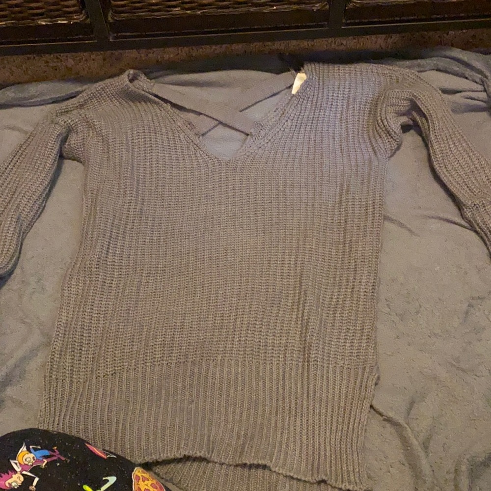 Gray sweater crossed in back
